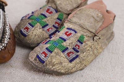 Lot 342 - A collection of Native American children's beaded hide moccasins