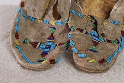 Lot 330 - Two pairs of Native American beaded hide moccasins