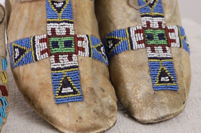 Lot 330 - Two pairs of Native American beaded hide moccasins