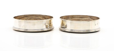 Lot 14 - A pair of modern silver wine coasters