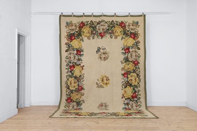 Lot 574 - A large needlepoint rug