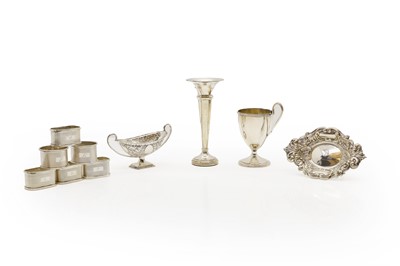 Lot 39 - A set of four silver napkins rings