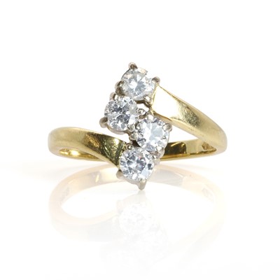 Lot 144 - An 18ct gold four stone diamond ring