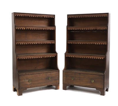 Lot 600 - A pair of Regency-style mahogany waterfall bookcases