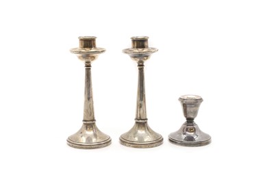 Lot 22 - A group of three silver candlesticks