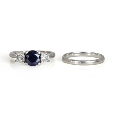 Lot 205 - A platinum sapphire and diamond three stone ring