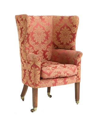 Lot 571 - A wing back armchair