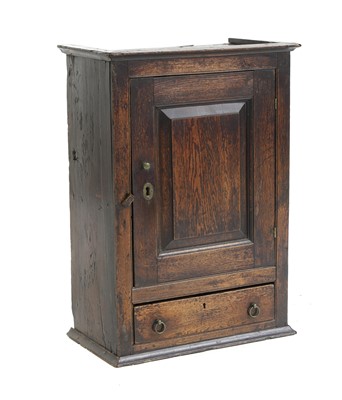 Lot 577 - An oak spice cupboard