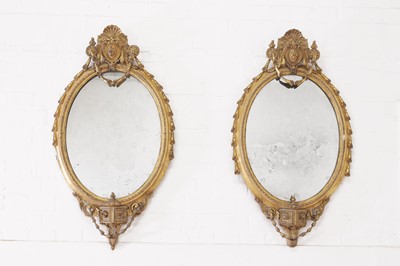 Lot 1 - A pair of carved giltwood and gesso girandole mirrors