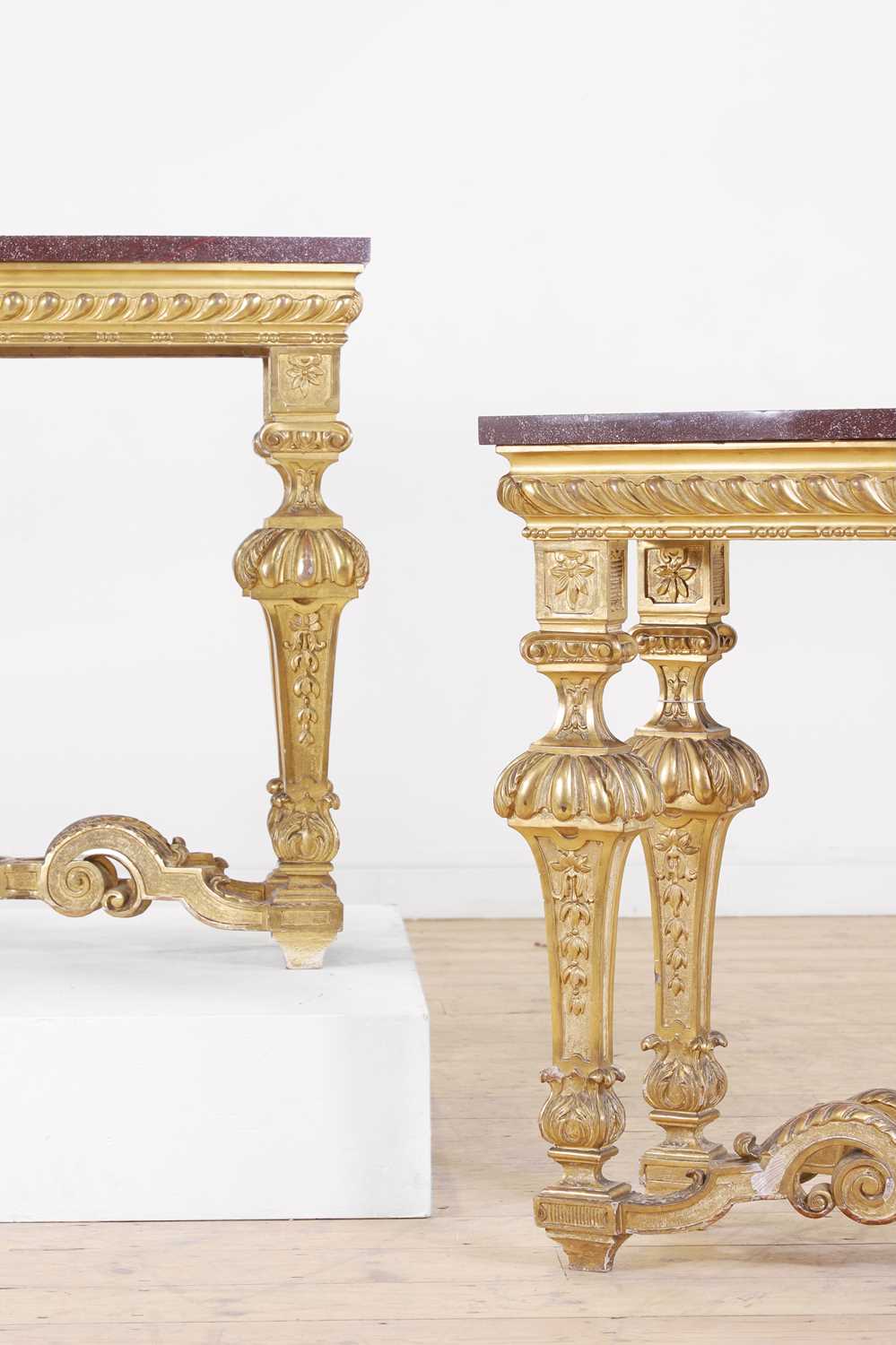 Lot 21 - A pair of Louis XIV-style giltwood console tables