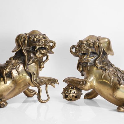 Lot 142 - A pair of Chinese gilt-bronze Buddhist lions