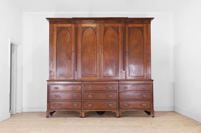 Lot 49 - A George III oak housekeeper’s cabinet