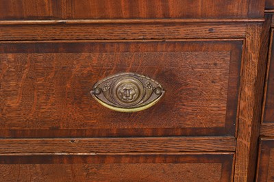 Lot 49 - A George III oak housekeeper’s cabinet