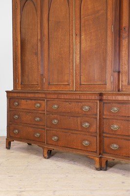 Lot 49 - A George III oak housekeeper’s cabinet