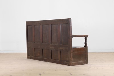 Lot 58 - A panelled oak settle