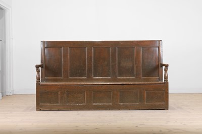 Lot 58 - A panelled oak settle