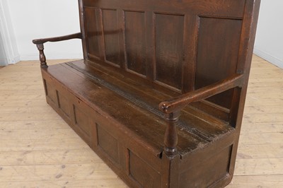 Lot 58 - A panelled oak settle