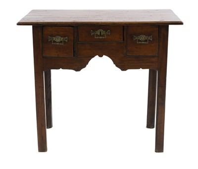 Lot 717 - A George III oak lowboy