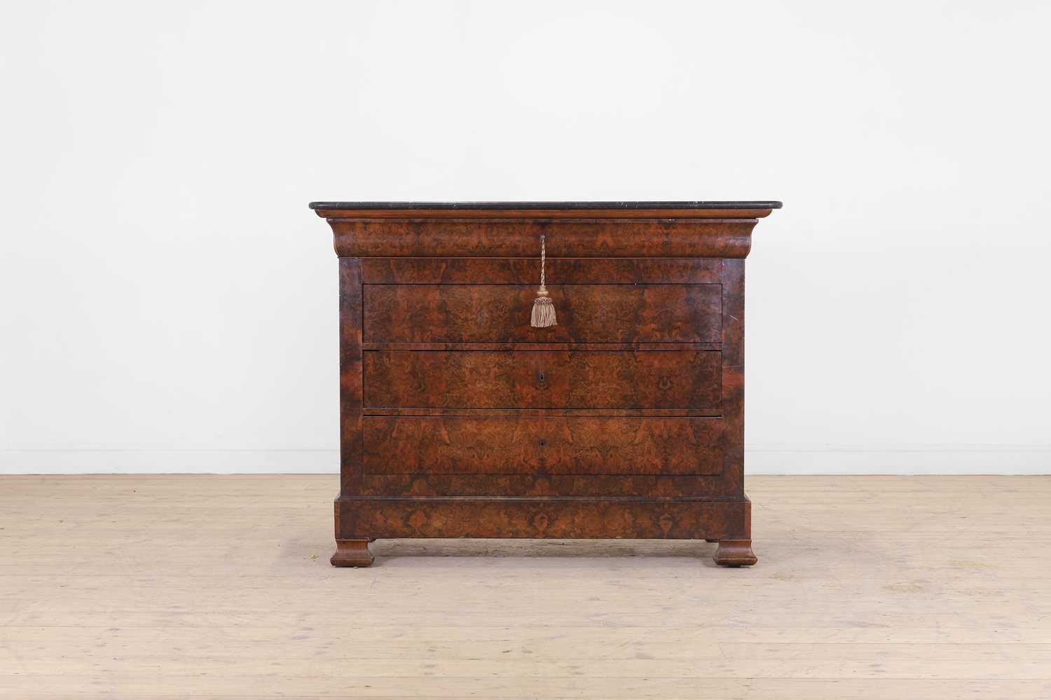 Lot 52 - A Louis Philippe figured walnut commode