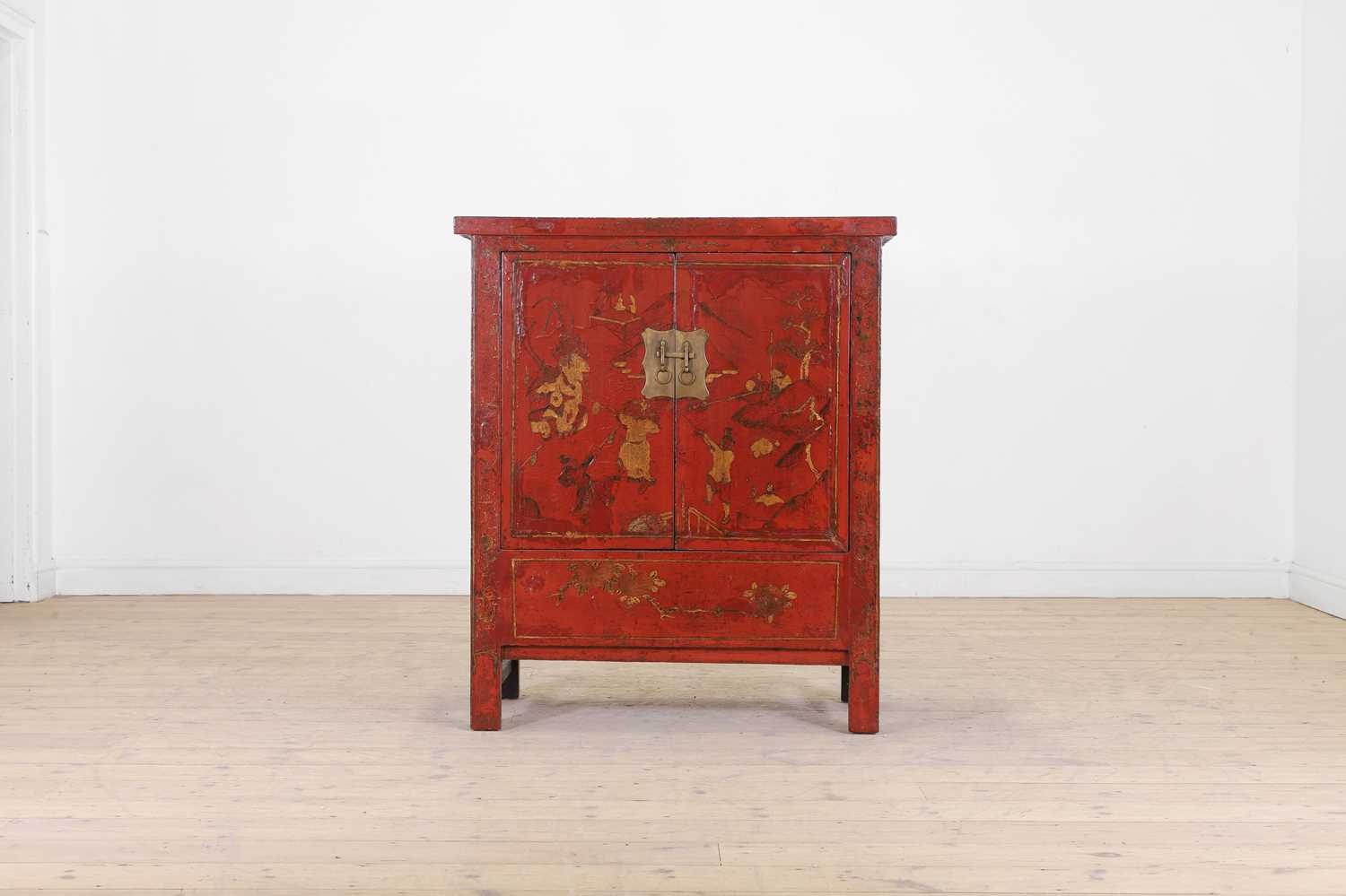 Lot 64 - A red-lacquered wooden cabinet