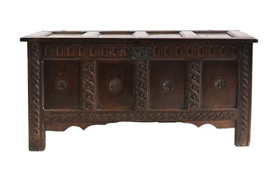 Lot 667 - A carved oak coffer