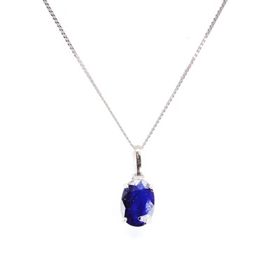 Lot 1162 - A white gold sapphire single stone pendant