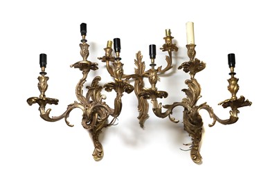 Lot 644 - A pair of Louis XV ormolu three light wall sconces