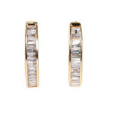 Lot 1130 - A pair of 'inside-out' diamond hoop earrings