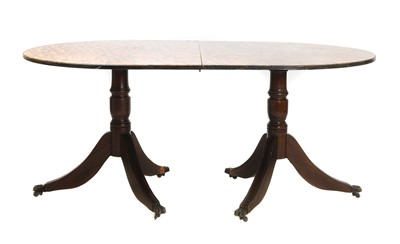 Lot 435 - A reproduction twin pedestal faux tortoiseshell dining table