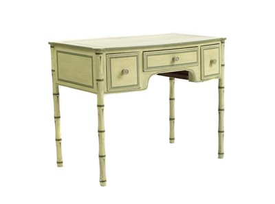 Lot 382 - A Regency painted faux bamboo bow front dressing table