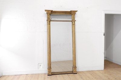 Lot 152 - A Regency-style carved giltwood pier glass