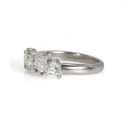 Lot 108 - A platinum and heart shaped diamond five stone ring