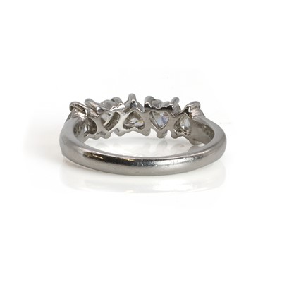 Lot 108 - A platinum and heart shaped diamond five stone ring
