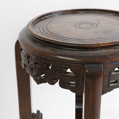 Lot 439 - A Chinese hardwood vase stand