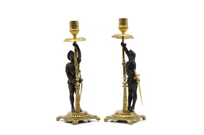 Lot 302A - A pair of gilt metal figural candlesticks