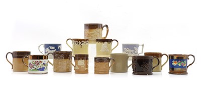 Lot 162 - A group of fourteen stoneware and pottery mugs