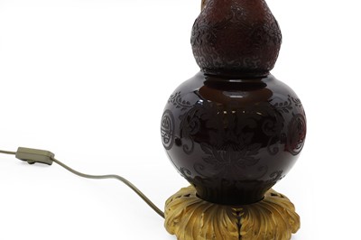 Lot 541 - An Art Deco Steuben Plum Jade style glass lamp base