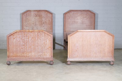 Lot 118 - A pair of Heal and Son limed oak single beds