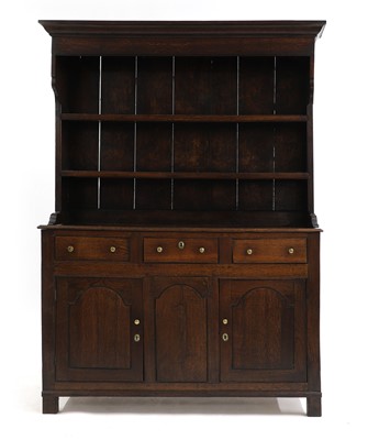 Lot 678 - A small George III oak dresser