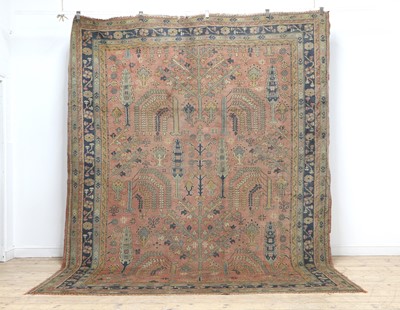 Lot 500 - A faded Turkish carpet