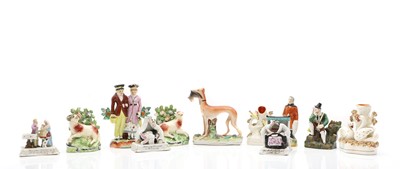 Lot 187 - A collection of Staffordshire figures