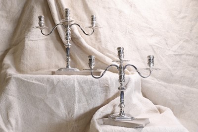 Lot 408 - A pair of George I-style silver candelabra