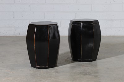 Lot 418 - A near pair of black-lacquered drum stools