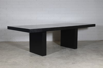 Lot 458 - A contemporary dark hardwood dining table