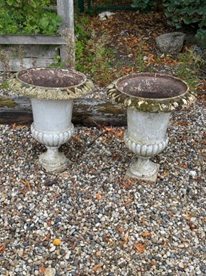 Lot 457 - A pair of cast iron campagna urns