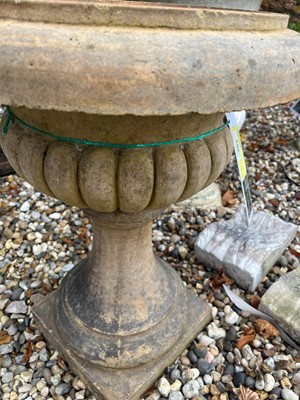 Lot 704 - A terracotta low garden urn