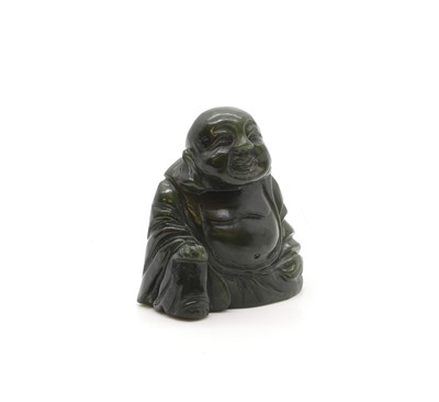 Lot 59 - A sage green jade buddha