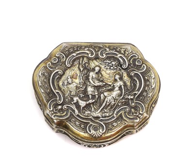 Lot 10A - A silver repousse cartouche shaped tobacco box