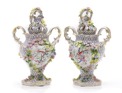 Lot 320 - A pair of Schierholz encrusted porcelain vases and covers