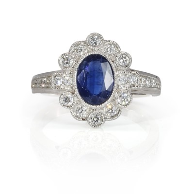 Lot 207 - An 18ct white gold sapphire and diamond ring